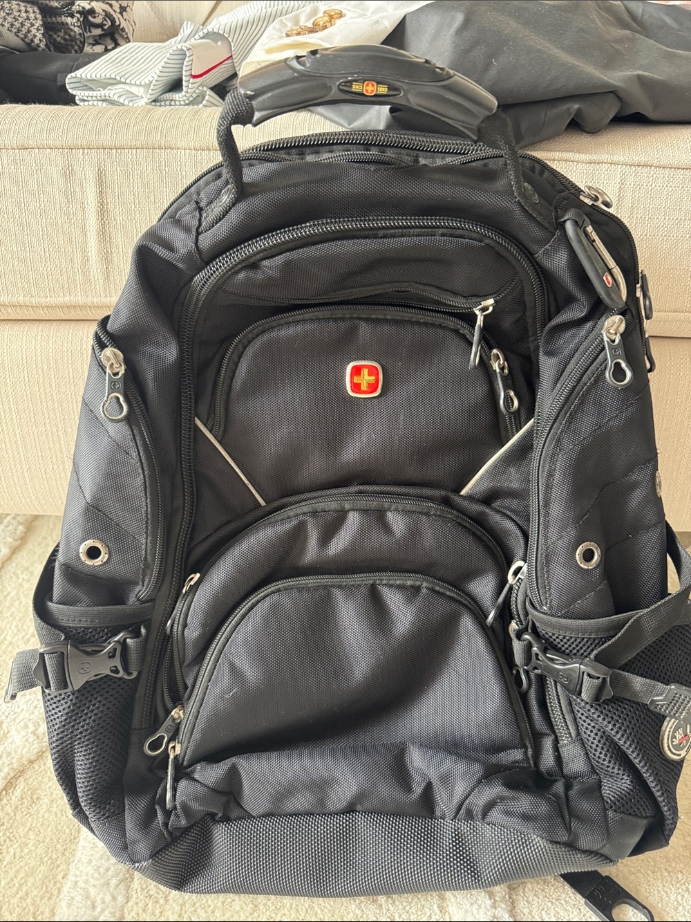 SwissGear Black Backpack with Red Logo - Multi-Compartment Travel Pack